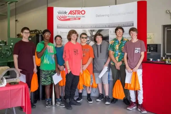 Students smiling for picture at Astro Machine Work's National Manufacturing Day celebration Students smiling for picture at Astro Machine Work's National Manufacturing Day celebration