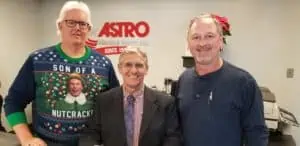Brian Paul, Keith Yohn, and Eric Blow smiling after scholarship check given